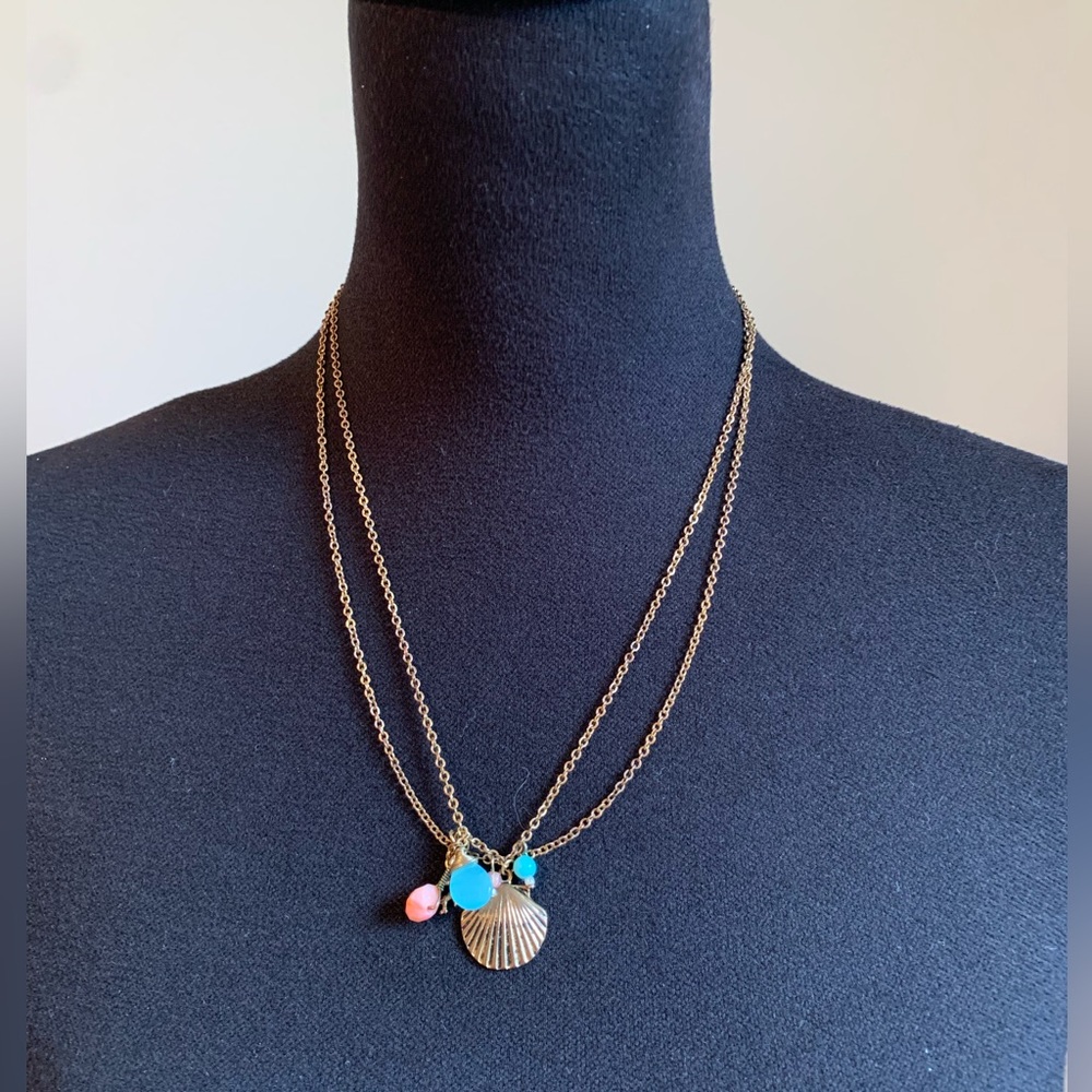 Gold toned shell charm necklace